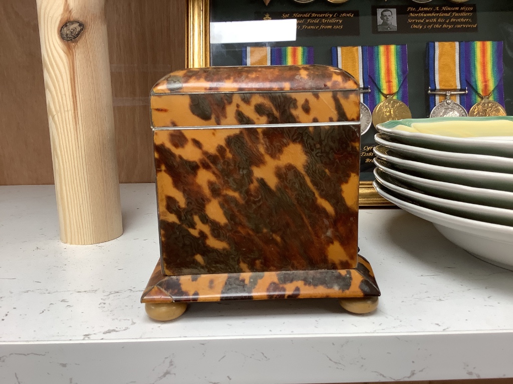 A 19th century tortoiseshell and ivory tea caddy, width 8.5cm height 11cm